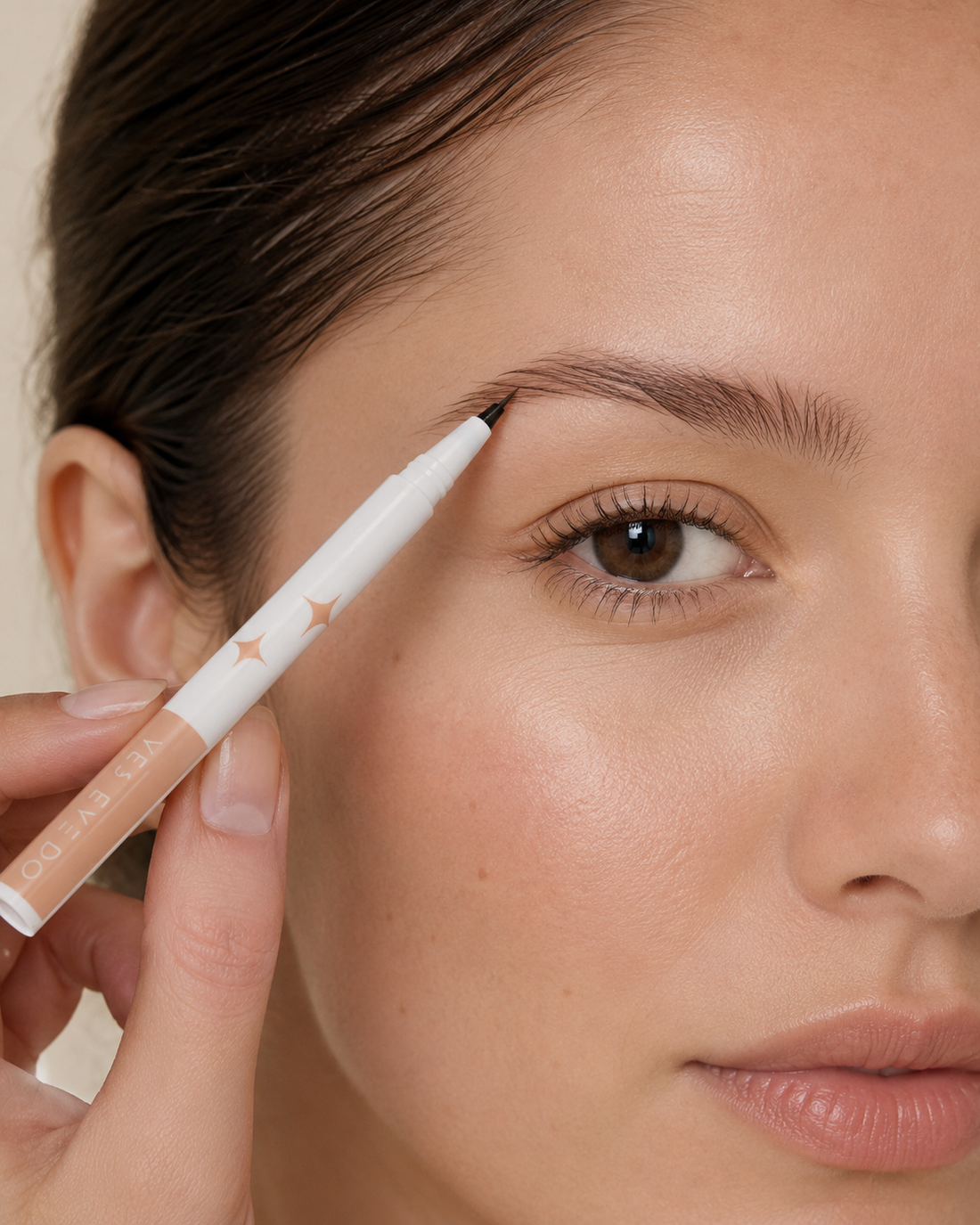 Model drawing hair-like brow strokes with the YES.EYE DO Micro Precision Brow Pen