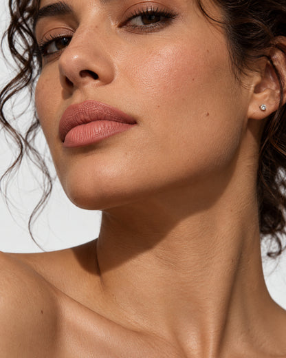 Close-up look with a nude rose lip liner and matching lipstick