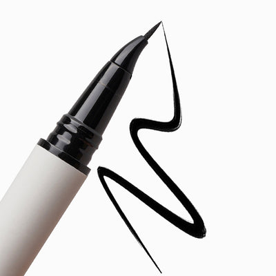Close-up of the Eagle Claw angled felt tip beside a zigzag black eyeliner swatch on a white background