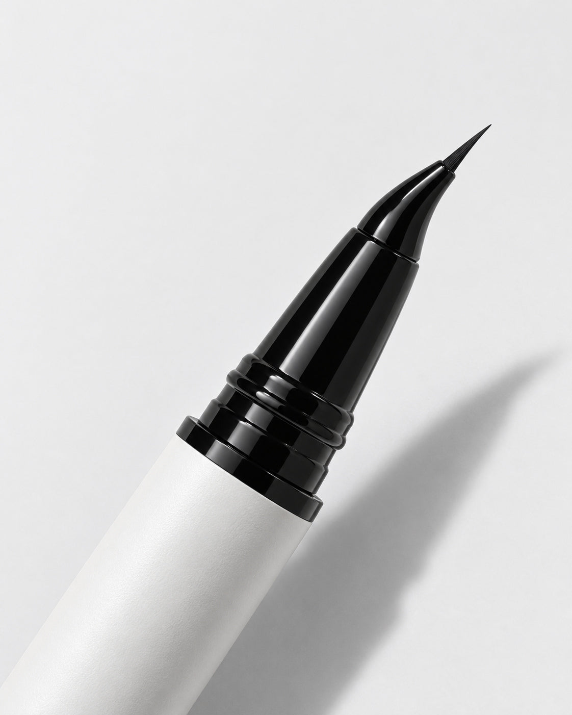 Close-up of the angled eyeliner's curved neck and single fine beak tip