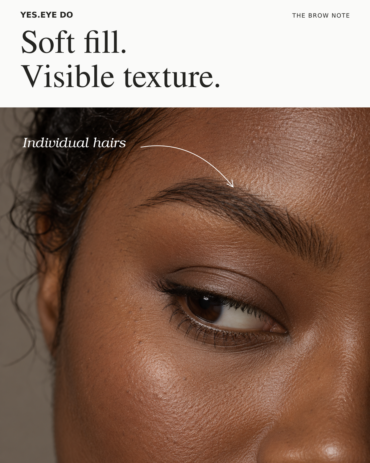 Editorial close-up of a brow filled with soft color while individual hairs stay visible