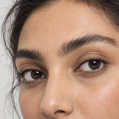 Close-up of eyes with softly defined dark-brown brows