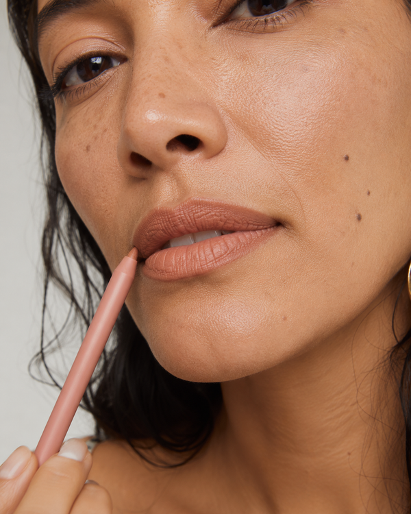 Aisha pairs Iconic Nude liner + brow pen.