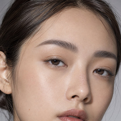 Model with soft grey-taupe pomade brows