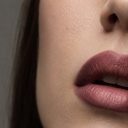 Mauve-plum lip liner look, close-up of lined lips