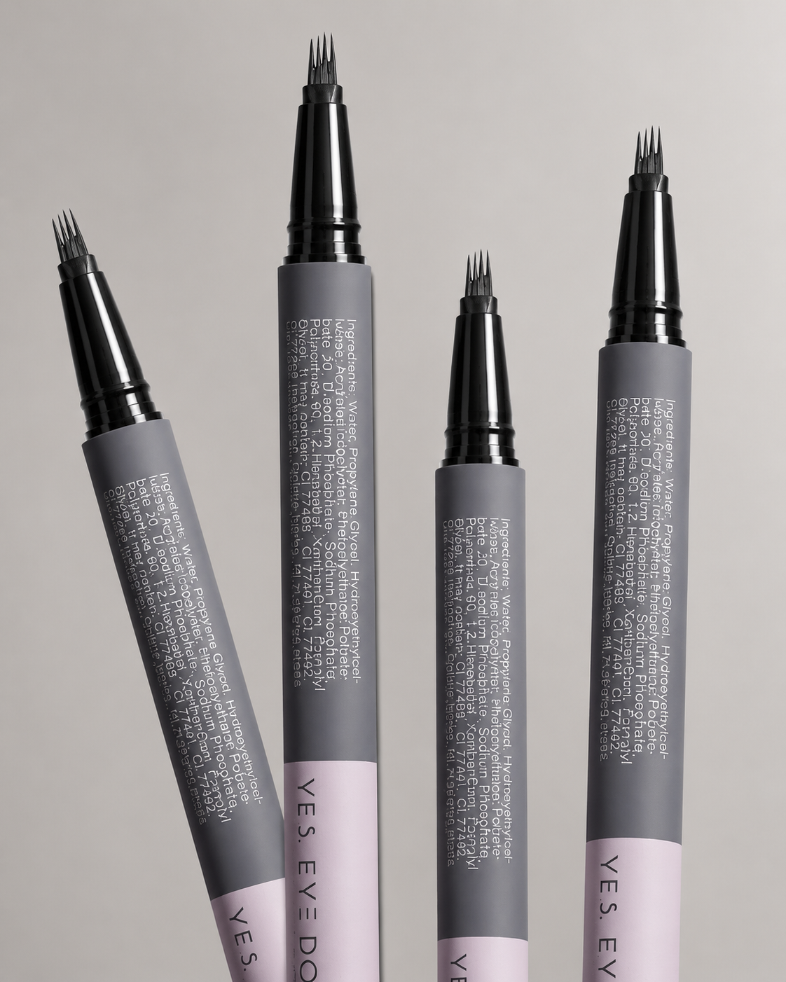 Four 4-prong brow pens standing tip-up showing the micro-prong tips
