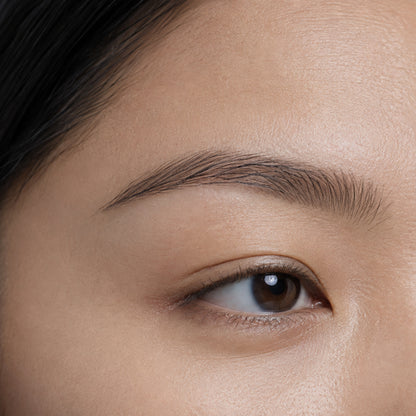 Shadow Granite shade reference: brows softly filled in a cool ashy grey-brown tone