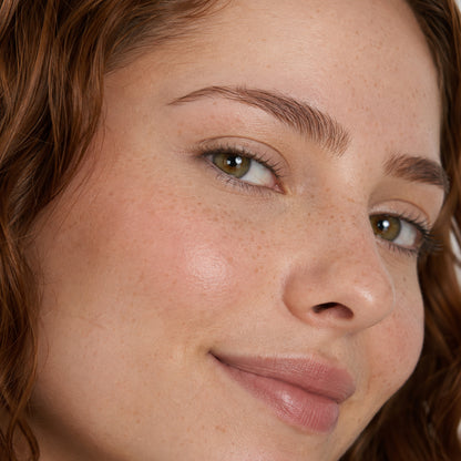 Walnut Whisper shade on model: medium warm-brown brows with a soft natural finish